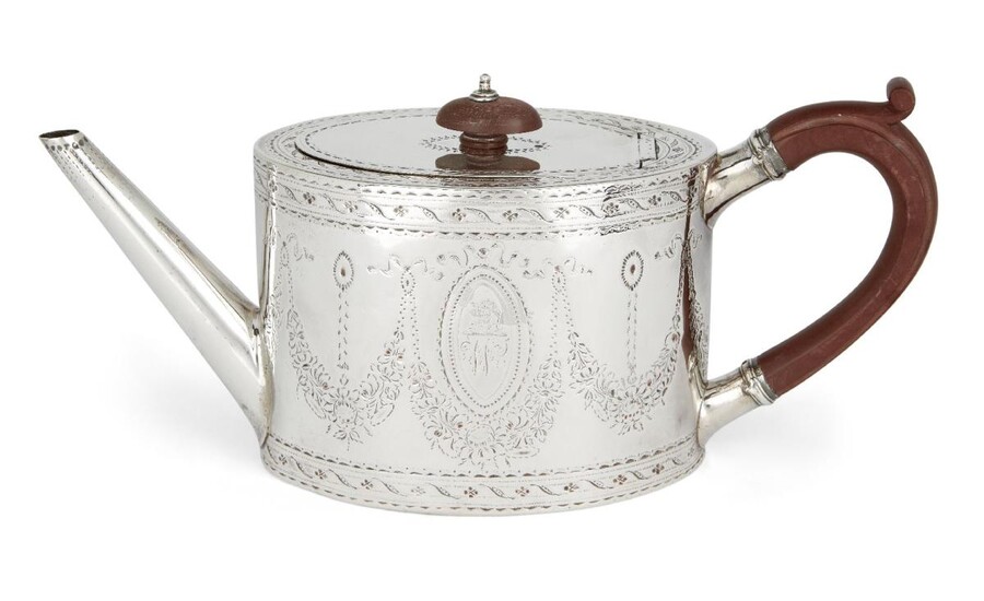 A George III silver teapot, London, 1784, Robert Hennell I, of oval form, the sides bright-cut decorated with floral garlands surrounding engraved cartouches to hinged lid with wooden finial, the brown Bakelite handle a later replacement, 10.1cm...