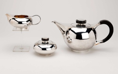 A German silver and gilt three piece tea service