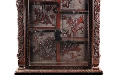 A Japanese carved hardwood cabinet