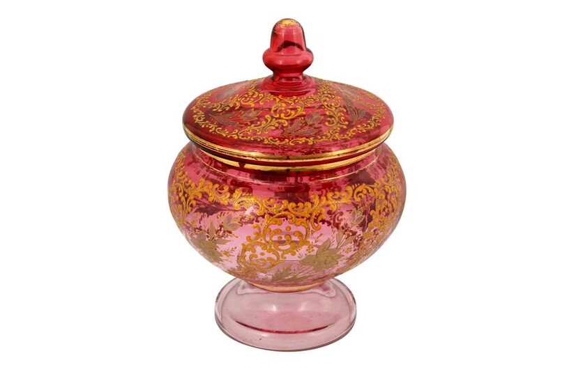 A LARGE GILT AND ENAMELLED PINK GLASS LIDDED BOWL Possibly Bohemia, Czech Republic for the Iranian export market, late 19th century