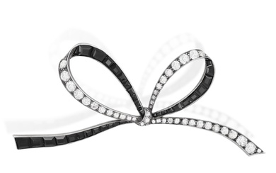 A LATE 19TH CENTURY DIAMOND AND ONYX BOW BROOCH Designed as...