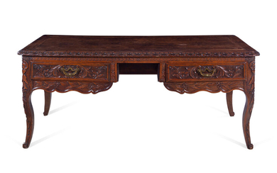A Louis XV Provincial Style Carved Walnut Desk