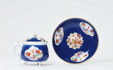 A Meissen porcelain cream pot and stand with midnight blue ground