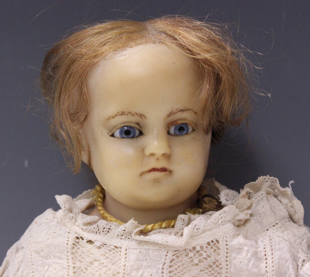Lot-Art | A Montanaris type wax head and shoulders doll with brown hair,  fixed blue eyes, painted eyebrows and