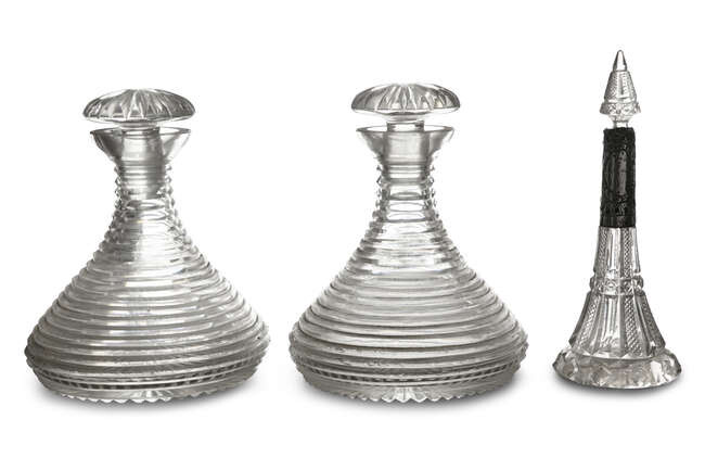 A PAIR OF 19TH CENTURY CUTCRYSTAL SHIPS DECANTERS,...