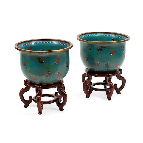A PAIR OF CHINESE CHAMPLEVÉ ENAMEL FISH BOWLS ON CARVED WOOD STANDS