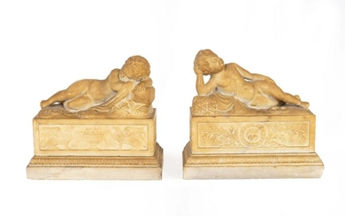 A Pair of Marble Models of Sleeping Cherubs on Plinths