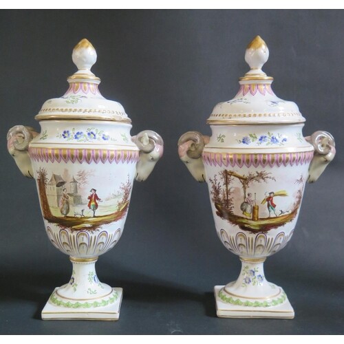 A Pair of Veuve Perrin Faience Rams Vases with ram's mask ha...