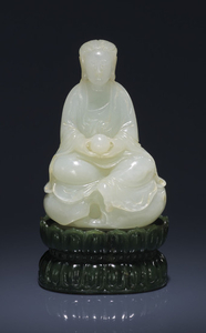 A RARE AND FINELY CARVED WHITE JADE FIGURE OF GUANYIN AND SPINACH-GREEN JADE 'LOTUS' STAND, QIANLONG PERIOD (1736-1795)