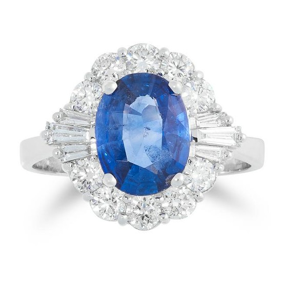 A SAPPHIRE AND DIAMOND DRESS RING set with an oval