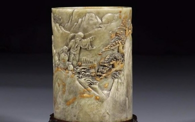 A SOAPSTONE BRUSH HOLDER CARVED WITH FIGURE AND
