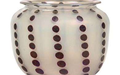 A Secessionist opalescent glass vase in the manner of Koloman Moser, Early 20th Century, unmarked, The oviform with everted rim, decorated with vertical rows of spots in a dark aubergine colour against a milky ground exhibiting a nacreous hue, 9.5...