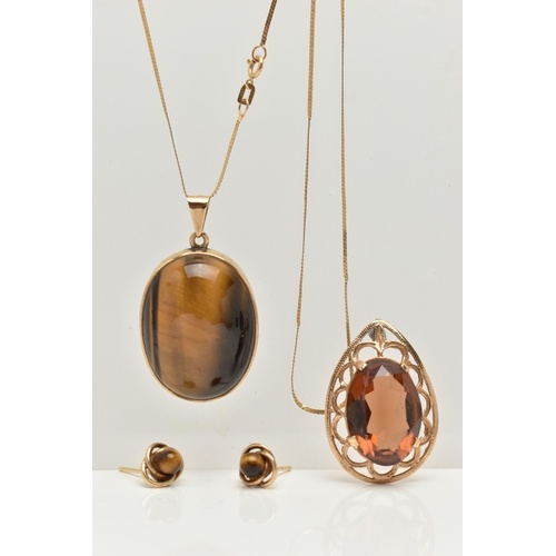 A TIGERS EYE PENDANT NECKLACE AND EARRING SET AND A SMOKY QU...