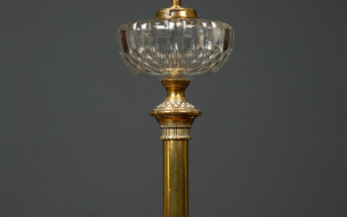 A Victorian brass based oil lam
