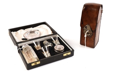 A Victorian leather cased glass hunting flask; and a travelling Holy Communion set
