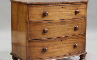 A Victorian mahogany bowfront chest of three long drawers, on turned legs, height 88cm, width 92cm