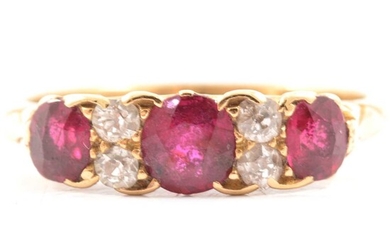 A Victorian ruby and diamond half hoop ring.