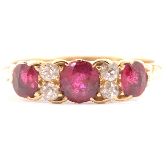 A Victorian ruby and diamond half hoop ring.