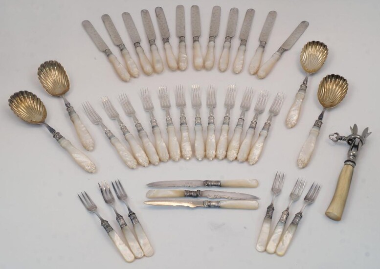 A Victorian set of mother of pearl handled cutlery, with silver acanthus chased collars and silver plated blades, bowls and prongs, Sheffield, 1883, comprising four serving spoons with shell bowls, twelve dessert forks, and eleven table knives...