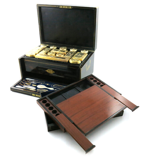 λA Victorian silver-gilt mounted travelling dressing table set