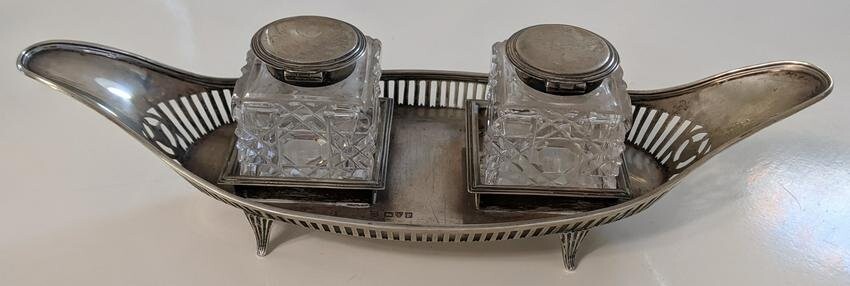 A Victorian silver inkwell, twin cut glass wells with