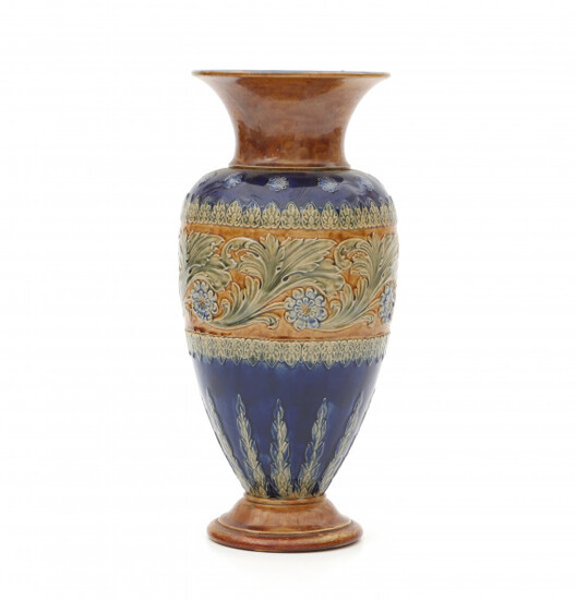 A blue and brown glazed stoneware vase, decorated with floral pattern, stamped underneath and with modelnumber 8082.