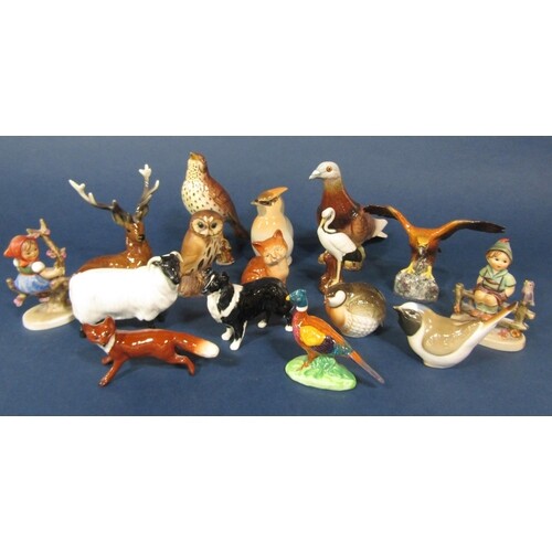 A collection of Beswick and other model animals and birds in...