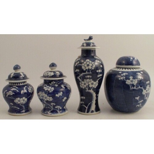 A collection of four Chinese blue and white prunus vases, to...