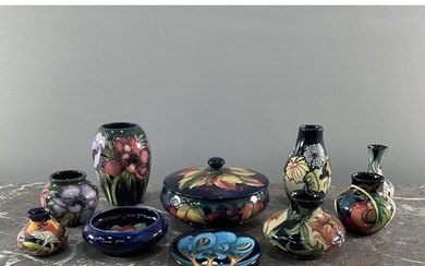 A collection of ten Moorcroft vases and bowls comprising an ...
