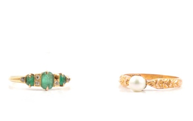 A cultured pearl ring and emerald ring.