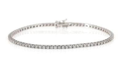 A diamond bracelet set with numerous brilliant-cut diamonds weighing a total of...