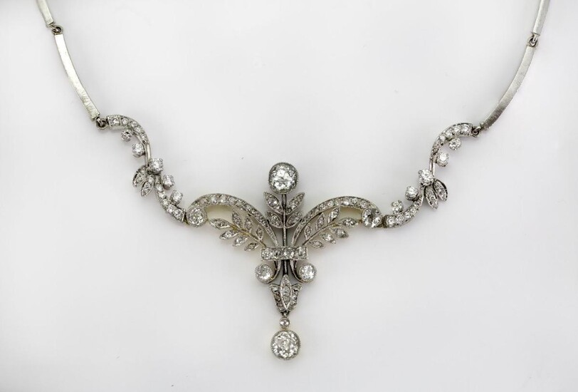 A diamond necklace, of foliate scroll design set with circular-, single- and rose-cut diamonds to a later baton link chain, length approximately 42cm, c 1900 and later.