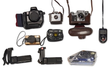 A group of cameras and assorted accessories
