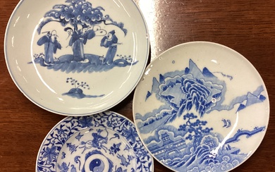 A group of three Chinese blue and white dishes of typical form.