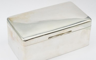 A large George V plain silver cigarette box of slightly...