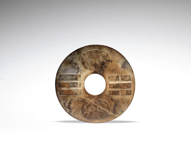A large archaic-style jade disc, bi