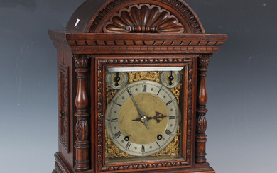 A late 19th century oak bracket clock with two train eight day movement striking quarters on two gon