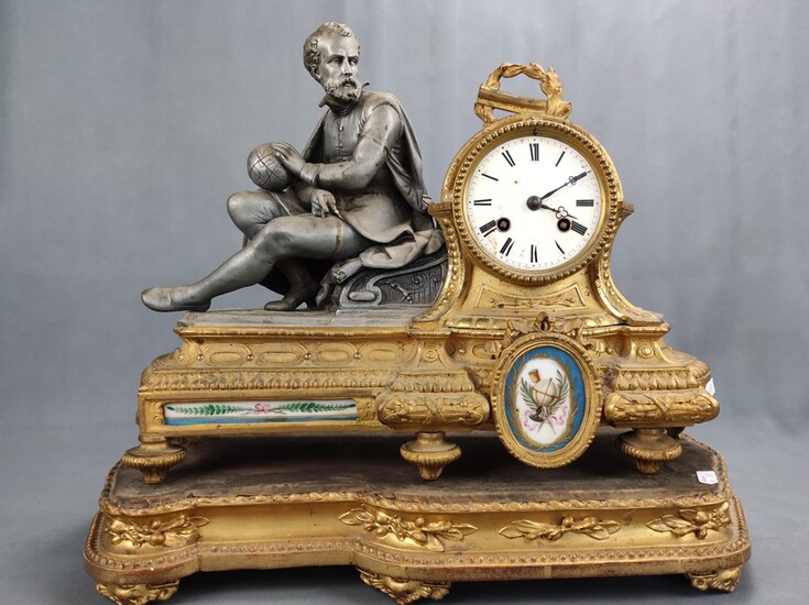 A mantel clock / table clock with cosmograph, seated scholar with compass and globe, on the right r
