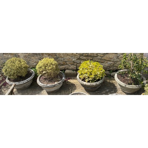 A matched set of four composite garden planters, 62 cm diame...