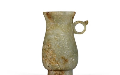 A mottled celadon jade baluster vase set with a single loop handle Ming dynasty | 明 青玉瓶