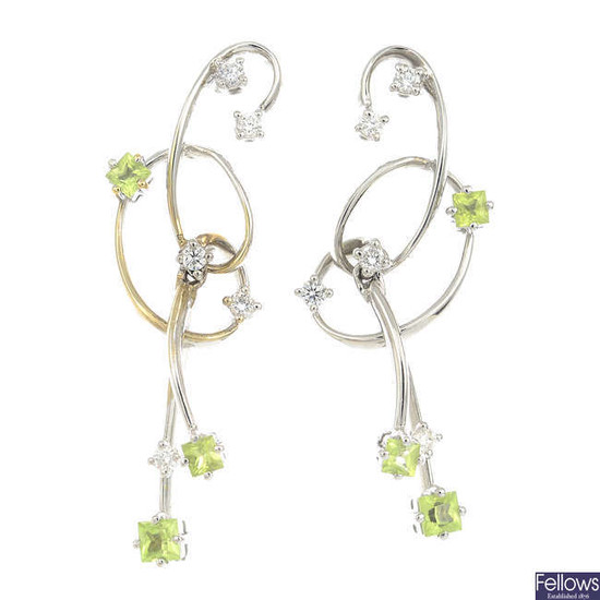 A pair of 18ct gold diamond and peridot earrings.
