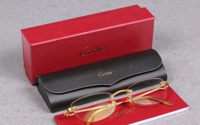 A pair of Cartier gold plated framed rimless Eye glasses / s...