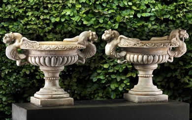 A pair of Continental sculpted white marble garden urns in Neoclassical style