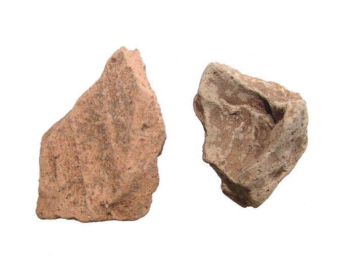 A pair of Etruscan terracotta sculptural fragments