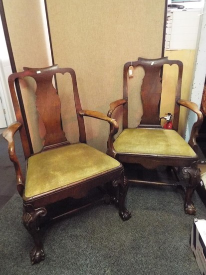 A pair of George II walnut carver chairs having vase shaped ...