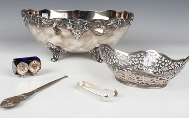 A pair of George V silver sugar tongs, Birmingham 1927, and a silver handled buttonhook, Chester 190
