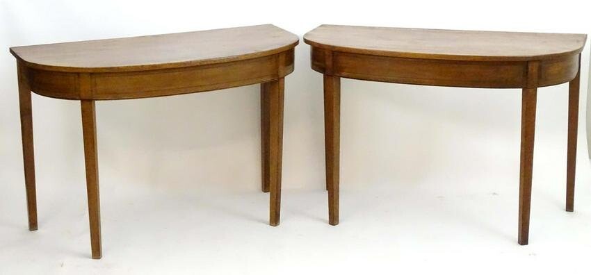 A pair of Georgian mahogany D-end tables with ebony