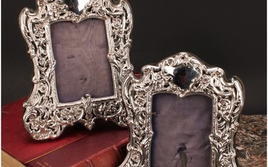 A pair of Victorian silver easel photograph frames, pierced ...