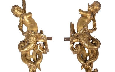 A pair of carved giltwood mounts