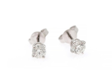 A pair of diamond ear studs each set with a brilliant-cut diamond weighing a total of app. 0.67 ct., mounted in 18k white gold. F/SI2-P1. (2)